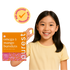 Child holding a single Purest Kids omega-3 burstlet with product box — kid-approved, 100% plant-based and vegan
